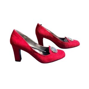 Women’s red suede heels closed toe w jewelry on the toe. By Newport News Size 11